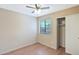 The bedroom features neutral walls and flooring with a window that allows natural light to illuminate the space at 2112 E Donald Dr, Phoenix, AZ 85024