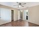 This is a bedroom with modern vinyl floors and a large closet near an entrance to the bathroom at 2112 E Donald Dr, Phoenix, AZ 85024