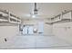 Spacious garage featuring laundry appliances, a utility sink, and overhead shelving for ample storage at 2112 E Donald Dr, Phoenix, AZ 85024