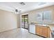 Bright eat-in kitchen with stainless steel appliances and access to the backyard through sliding glass doors at 2112 E Donald Dr, Phoenix, AZ 85024