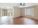 An open-concept area with a view of a kitchen, living room, and sliding glass door at 2112 E Donald Dr, Phoenix, AZ 85024