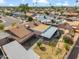 Aerial view of a home with a private backyard featuring a covered patio, pergola, and well-maintained landscaping at 2217 N 51St Ln, Phoenix, AZ 85035