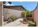 Wonderful backyard landscaping with potted plants along the walkway at 2217 N 51St Ln, Phoenix, AZ 85035