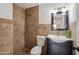 Elegant bathroom with tiled shower, vanity, decorative mirror and fixtures at 2217 N 51St Ln, Phoenix, AZ 85035