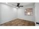 Bedroom with neutral paint, a ceiling fan, and a window with blinds at 2217 N 51St Ln, Phoenix, AZ 85035