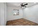 Bedroom with tile flooring, a ceiling fan, and a window with blinds at 2217 N 51St Ln, Phoenix, AZ 85035