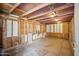 Unfinished garage with exposed wood and concrete floor, ready for customization at 2217 N 51St Ln, Phoenix, AZ 85035