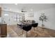 Bright living room with tile floors, modern decor, a ceiling fan, and ample natural light at 2217 N 51St Ln, Phoenix, AZ 85035