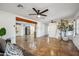 Open concept living room featuring hard flooring, neutral paint and decor, and exposed wood beam at 2217 N 51St Ln, Phoenix, AZ 85035
