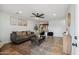 Cozy living room featuring tile floors, modern furniture, neutral colors, and a ceiling fan at 2217 N 51St Ln, Phoenix, AZ 85035