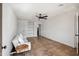 Bright living room with a ceiling fan, built-in shelving and modern furniture at 2217 N 51St Ln, Phoenix, AZ 85035