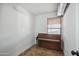 Cozy living room featuring a piano and a window with wood blinds at 2217 N 51St Ln, Phoenix, AZ 85035