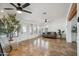 Open concept living room featuring hard flooring, neutral paint and decor, with multiple windows at 2217 N 51St Ln, Phoenix, AZ 85035