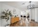 Bright living room with decorative lighting, hard flooring, and neutral decor, perfect for entertaining at 2217 N 51St Ln, Phoenix, AZ 85035