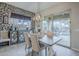 Dining room next to the kitchen, with views of the pool through the large sliding glass door at 2525 W Balao Dr, Phoenix, AZ 85085
