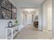 Inviting entryway features neutral colors, decorative art, a console table, and tile flooring at 2525 W Balao Dr, Phoenix, AZ 85085