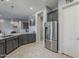 Modern kitchen with grey cabinets, stainless steel appliances, and granite countertops at 2525 W Balao Dr, Phoenix, AZ 85085