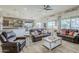Open concept living room with access to the dining room, and the kitchen at 2525 W Balao Dr, Phoenix, AZ 85085