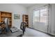 Small office space with a simple desk and shelves at 2525 W Balao Dr, Phoenix, AZ 85085