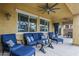 Covered patio with comfortable seating and view to the backyard at 2525 W Balao Dr, Phoenix, AZ 85085