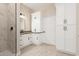 Bright bathroom features a walk-in shower and white cabinets for ample storage at 25450 W Pueblo Ave, Buckeye, AZ 85326