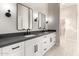 Modern bathroom with double sinks, sleek fixtures, and elegant lighting at 25450 W Pueblo Ave, Buckeye, AZ 85326