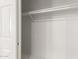 Empty closet features a rod for hanging clothes and ample space for storage at 25450 W Pueblo Ave, Buckeye, AZ 85326
