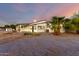 Charming single-story home featuring a white exterior, desert landscaping and lovely sunset views at 25450 W Pueblo Ave, Buckeye, AZ 85326