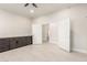 Additional view of flex room showcasing built-in cabinets and dual doors at 25450 W Pueblo Ave, Buckeye, AZ 85326