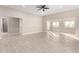 Large living room boasts tile flooring and abundant natural light at 25450 W Pueblo Ave, Buckeye, AZ 85326
