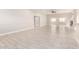 Spacious living room featuring tile flooring and bright natural light at 25450 W Pueblo Ave, Buckeye, AZ 85326