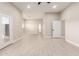 Bright living room with light tile flooring, neutral walls, recessed lighting, and an open floor plan creating a welcoming space at 25450 W Pueblo Ave, Buckeye, AZ 85326