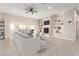 Spacious living room with tile floors, a fireplace, and built-in shelving at 25450 W Pueblo Ave, Buckeye, AZ 85326