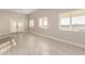 Bright living room with tile flooring, neutral tones, and views of the outdoors at 25450 W Pueblo Ave, Buckeye, AZ 85326