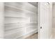Pantry featuring generous shelving space and a well-lit interior at 25450 W Pueblo Ave, Buckeye, AZ 85326
