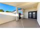 Covered patio featuring cool toned concrete and a gated yard at 25450 W Pueblo Ave, Buckeye, AZ 85326