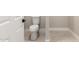 Picture of a standard white toilet with neutral-tone tile flooring at 25450 W Pueblo Ave, Buckeye, AZ 85326