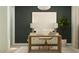 Stylish home office setup with modern desk, comfortable chair, and decorative plant at 2944 N 98Th Ln, Phoenix, AZ 85037