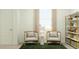 Cozy sitting area with modern furniture, soft lighting and stylish decor at 2944 N 98Th Ln, Phoenix, AZ 85037