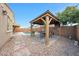 Backyard with a beautiful pool, covered patio, gazebo, and brick-paved walkway at 3359 E Penedes Dr, Gilbert, AZ 85298