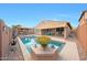 Backyard features a private pool, patio, outdoor kitchen and barbecue area at 3359 E Penedes Dr, Gilbert, AZ 85298