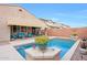 Backyard features a private pool, patio, and a pergola shaded lounge area at 3359 E Penedes Dr, Gilbert, AZ 85298