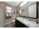 Charming bathroom with double sinks, granite counters, and modern fixtures at 3359 E Penedes Dr, Gilbert, AZ 85298
