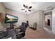 Office space with carpet flooring, a ceiling fan, and access to the hallway at 3359 E Penedes Dr, Gilbert, AZ 85298
