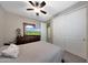 Cozy bedroom featuring carpet flooring, a ceiling fan, and closet at 3359 E Penedes Dr, Gilbert, AZ 85298