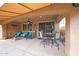 Relax on the covered patio with comfortable seating and enjoy the cool shade at 3359 E Penedes Dr, Gilbert, AZ 85298