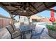 View from inside the gazebo to the pool, patio and back of the house, complete with backyard kitchen at 3359 E Penedes Dr, Gilbert, AZ 85298