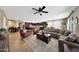Spacious living room with tile flooring, a ceiling fan, and an open floor plan at 3359 E Penedes Dr, Gilbert, AZ 85298