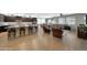 Open living area with an island bar, a dining area, and a comfortable seating space at 3359 E Penedes Dr, Gilbert, AZ 85298