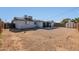 Back of house featuring covered patio, block wall, storage shed, and gravel cover at 3422 W Poinsettia Dr, Phoenix, AZ 85029